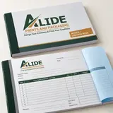Illustrative Alide-branded service invoice and job-card book